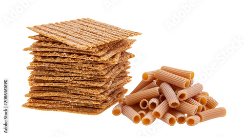 Obraz na płótnie Stack of square crackers next to pile of rigatoni pasta