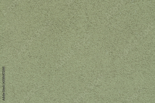 Fotografie Green textured surface with fine grain and subtle unevenness