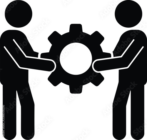 Two people working together to manage a large industrial gear
