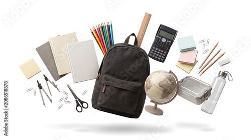 Floating school supplies with a black backpack and various stationery items isolated on white background.