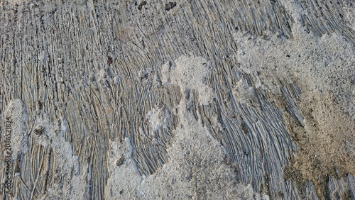 Textured Scratch Marks on Rough Concrete Surface Background