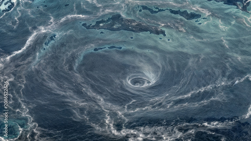Vászonkép Drone view of a turbulent ocean surface with swirling patterns of white foam and