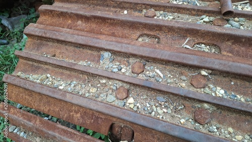Rusty corrugated metal roof covered with moss