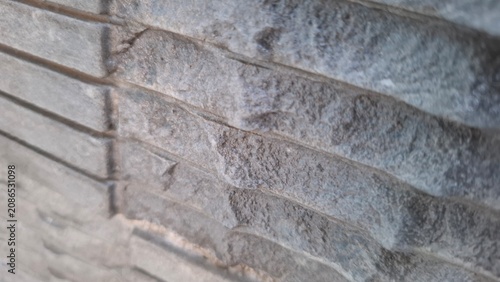 Textured grey concrete surface with fine grooves