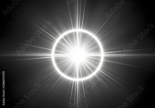 Bright white circular lens flare with radiating starburst rays on a black background