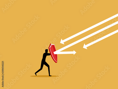 Fotografía businessman has a shield to protect him from attacks