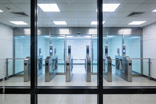 Canvastavla Modern security turnstile gates in a clean, bright office building entrance