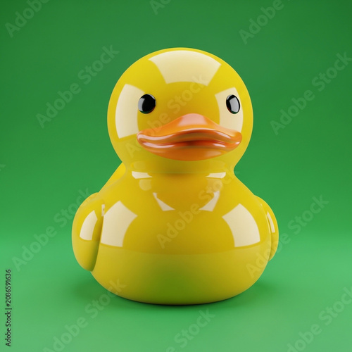 Shiny Yellow Rubber Ducky on Green Background