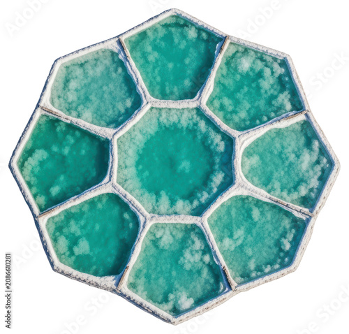 Aerial view of hexagonal turquoise salt evaporation ponds on a transparent backdrop