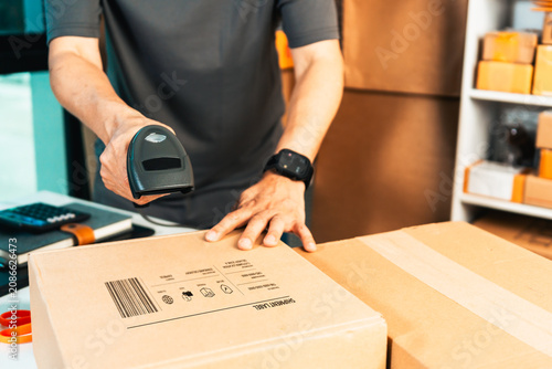 Canvastavla Handheld Barcode Scanner Scanning Shipping Parcel at Packaging Workspace