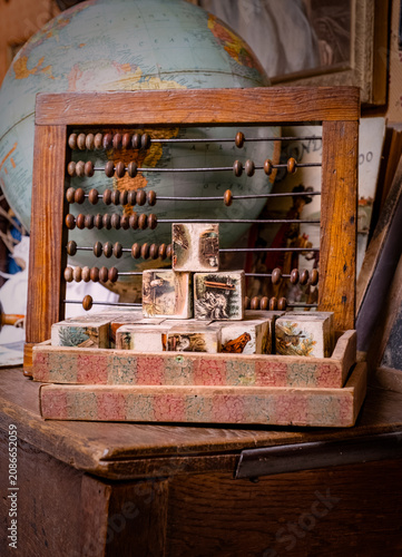 Canvastavla Vintage Abacus, Globe & Children's Building Blocks In A Nursery