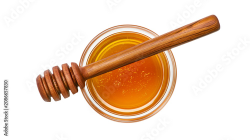 фотографія Wooden honey dipper resting on a glass bowl of golden honey, isolated on transpa