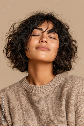 Woman Dark Curly Bob Eyes Closed Peaceful Serene Beige Background Mindful Calm