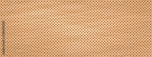 Photos Beige pegboard texture with tiny peg holes and perforated wood grain