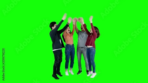 Diverse Group of Young Friends Joining Hands and Cheering on Green Screen
