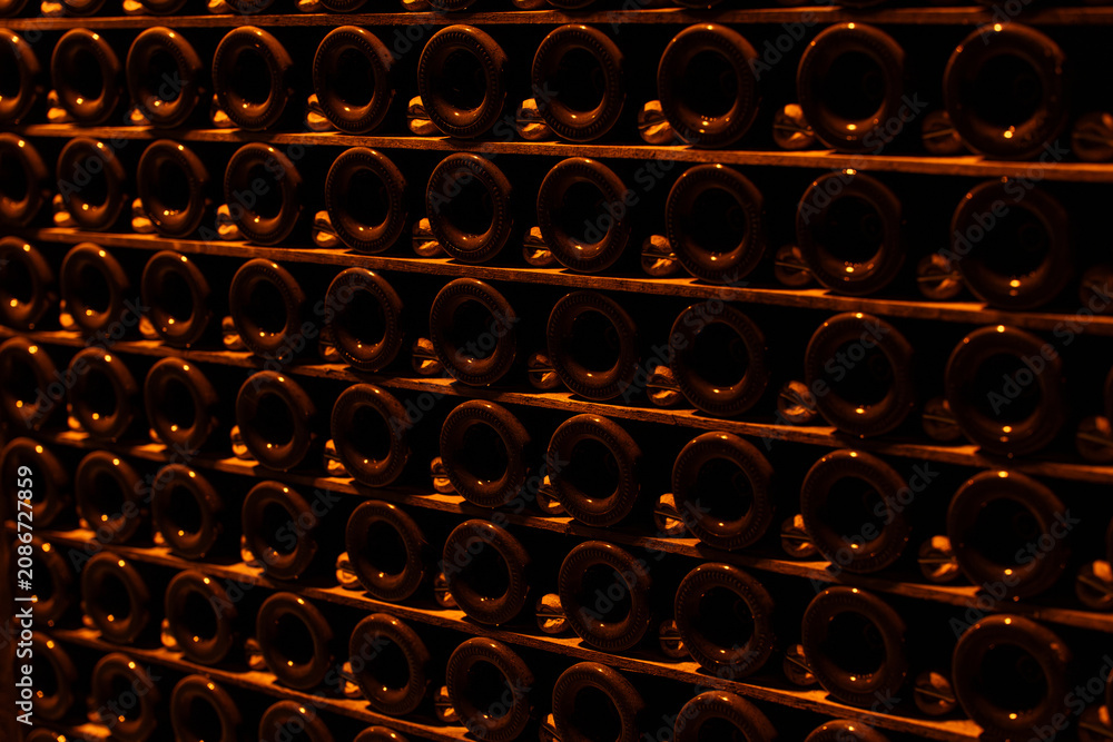 Obraz premium Wall of champagne bottles aging in a cellar