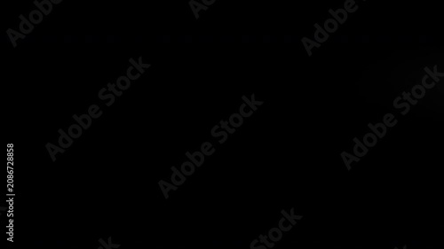 Animation of a stylized comet moving slowly from left to right, leaving a trail of smoke  on a black background.