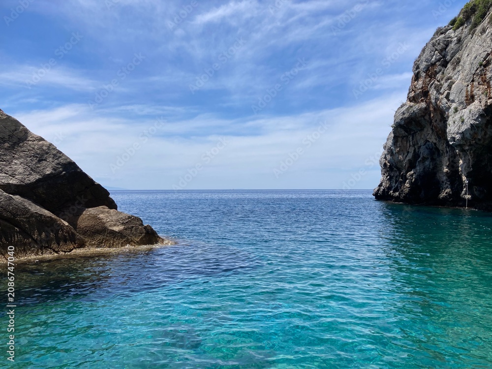 Obraz premium Turquoise and blue waters and rocky coastline on Lesbos, Greece