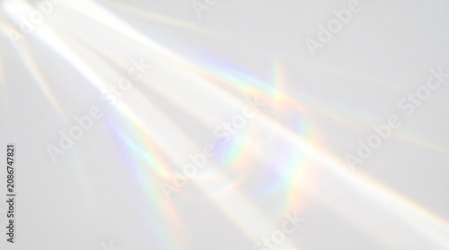 Abstract white background with diagonal prism light beams and rainbow spectral colors