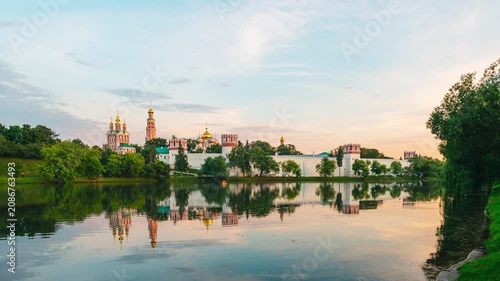 A timelapse of rapidly moving clouds in the sky at sunset over the Novodevichy Convent in Moscow