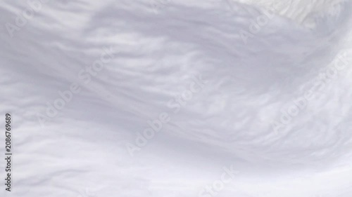 Soft white fabric background with crinkled texture waving