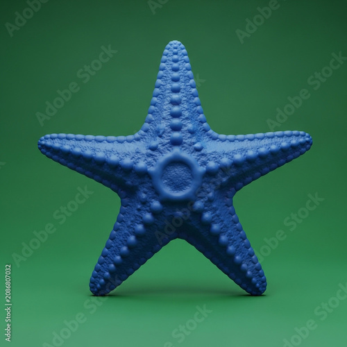 Blue starfish on green background
