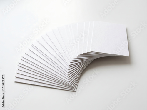 Stacked Blank White Rectangular Cards Fanned Out On A Clean Neutral Background