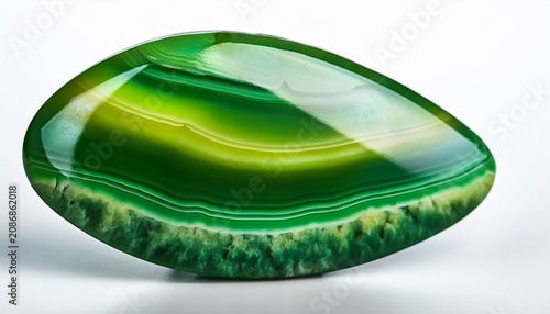 studying polished green moss agate stone gemstone on white background