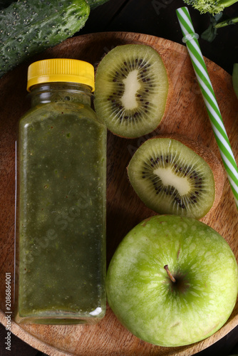Healthy food smoothie in a bottle made from green vegetables and fruits