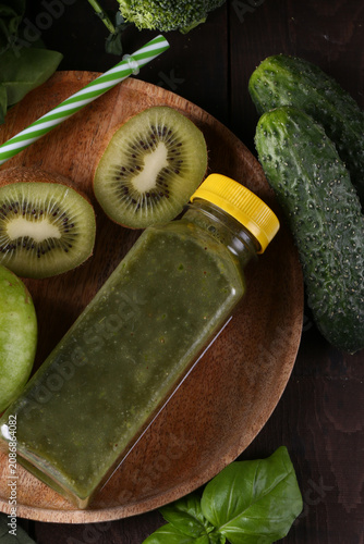 Healthy food smoothie in a bottle made from green vegetables and fruits