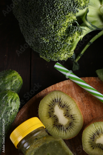 Healthy food smoothie in a bottle made from green vegetables and fruits
