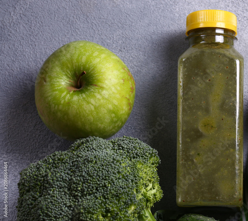 Healthy food smoothie in a bottle made from green vegetables and fruits