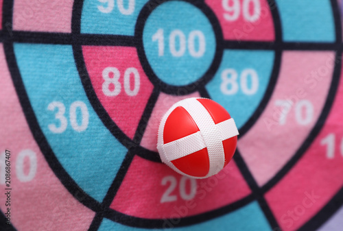 Target with balls. Darts with velcro.