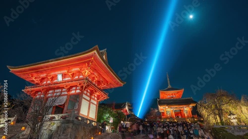 Timelapse of crowds of tourists entering the iconic Kiyomizu-dera temple at night in Kyoto, Japan.