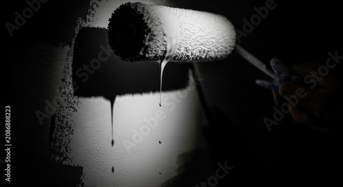 Painting Drips From Roller In Dramatic Lighting