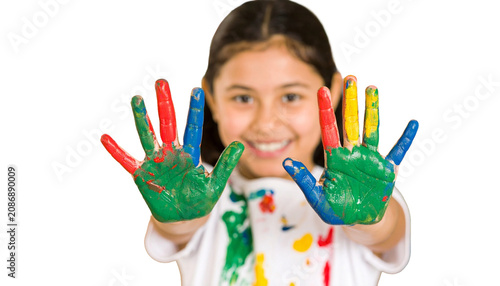 Happy little child showing colorful painted hand at camera, messy fingers covered in vibrant paint, enjoying creative art activity for early childhood