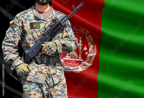 Photography Afghanistan flag with soldier holding assault rifle