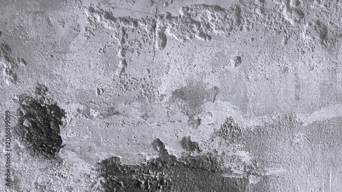 Fotografie Black and white rough plaster wall background with raised cement patches, moisture stains, pitted grain, and weathered texture