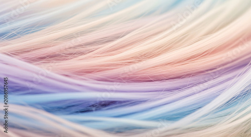Abstract pastel-colored hair strands in soft focus with a blurred background in shades of pink, blue, purple, and white.