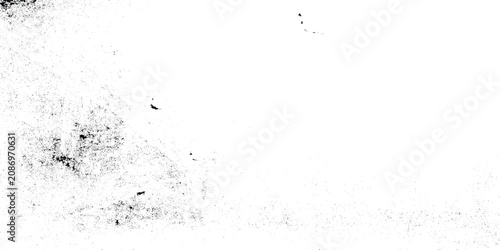 Fotografie Grunge textured background with black and white speckles and smudges on white su