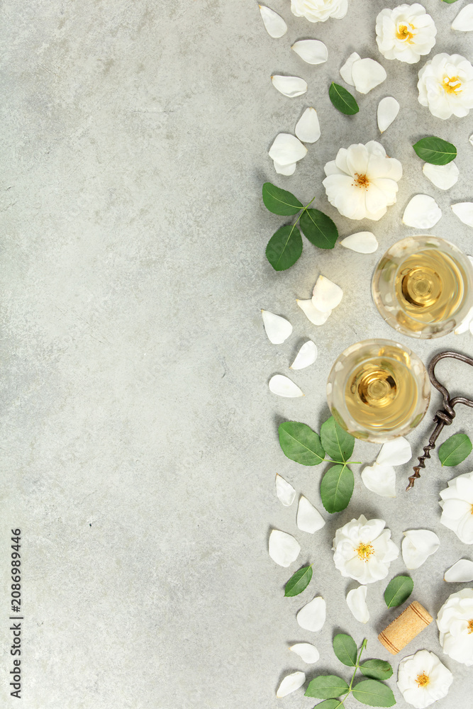 Obraz premium Wine Tasting Flat Lay with Roses, Petals, and Corkscrew
