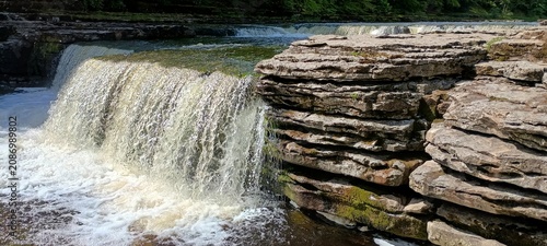 water flowing from the waterfall