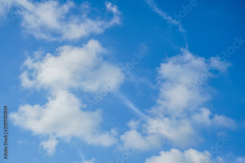 Bright Blue Sky With Soft White Clouds, Airy Cumulus Formations and Serene Daylight Atmosphere