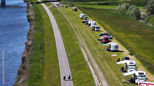 oadside tourism with campers on a dike with cyclists, Netherlands