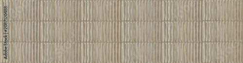 Taupe ceramic finger tiles forming a seamless vertical ribbed wall texture