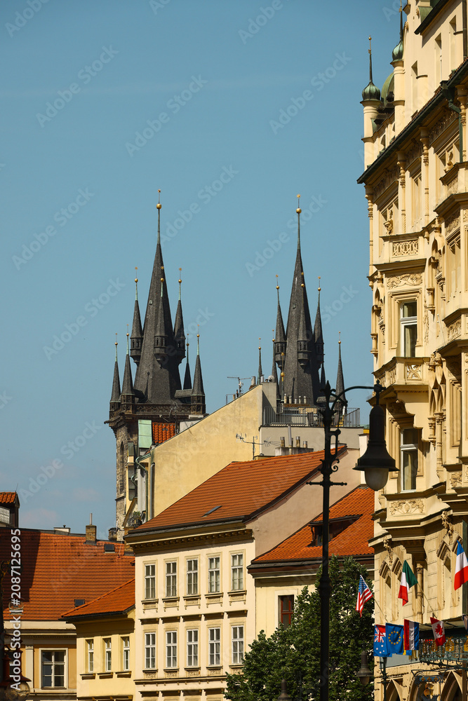 Fototapeta premium Church of Our Lady before T n towers rising above Prague Old Town rooftops