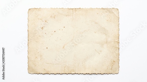 Old blank vintage photo paper with scalloped edges isolated on white background