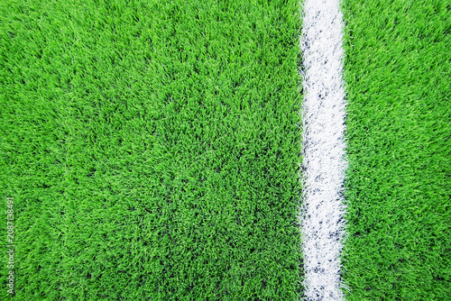 Football field white line artificial turf soccer field creating minimal sports background with detailed synthetic grass texture