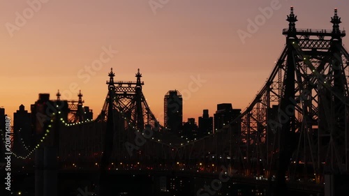 New York City Manhattan Midtown skyline from Queens, Queensboro bridge architecture, United States. Rooftop cityscape from Long Island Hunters Point. Urban sunset twilight dusk dark evening silhouette