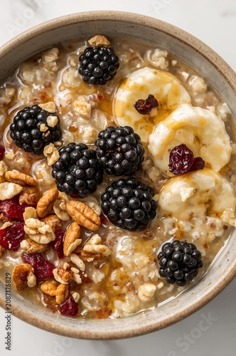 Bowl of Oatmeal With Fruits and Nuts for Breakfast in a Simple Kitchen Setting